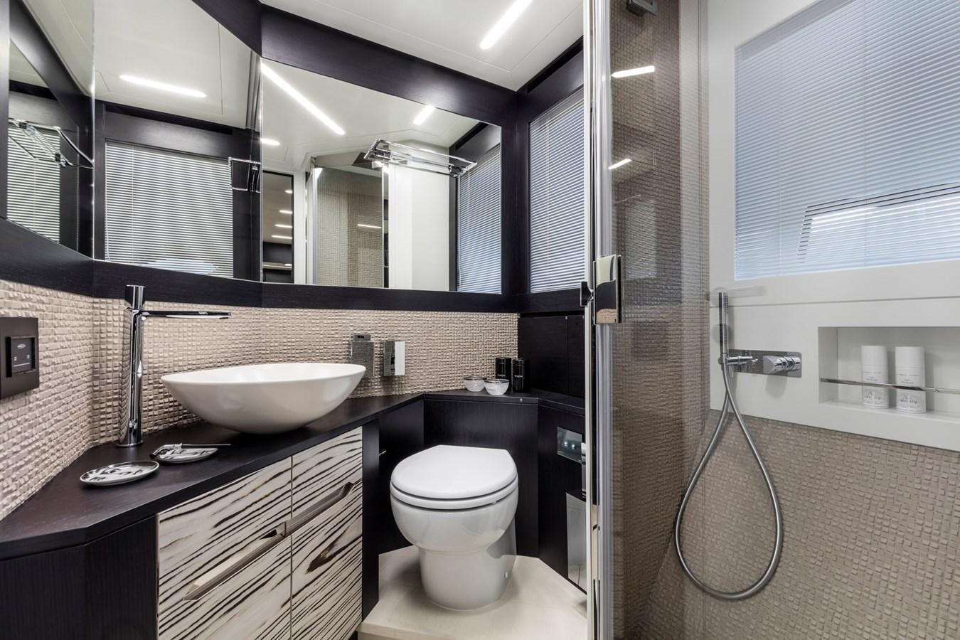 a bathroom with a sink and a toilet aboard PERSHING 8X   Yacht for Sale