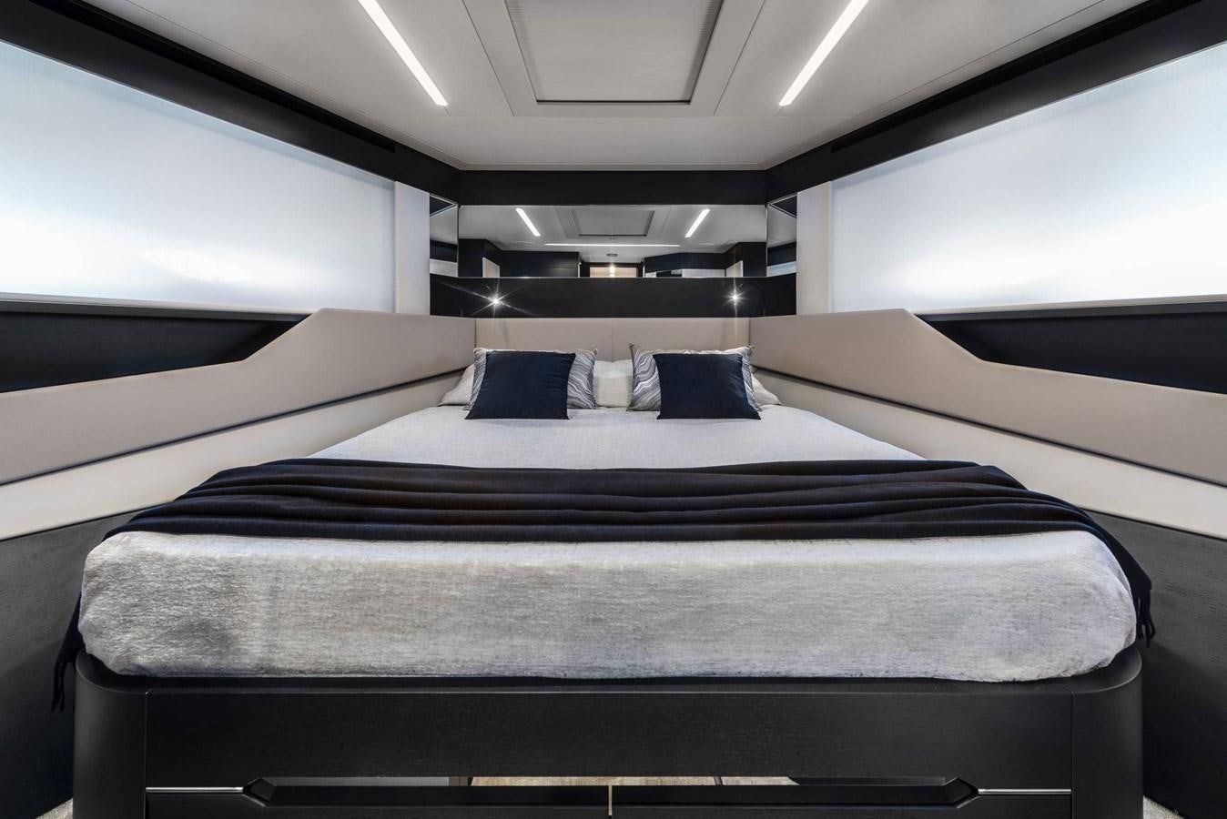 a room with a bed and a window aboard PERSHING 8X   Yacht for Sale