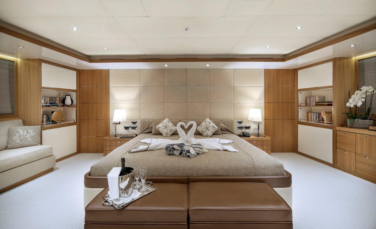 a large bedroom with a large bed aboard IRAVATI Yacht for Sale