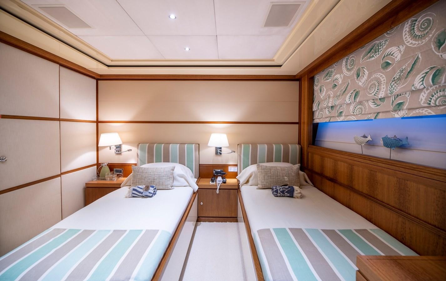 a room with two beds aboard IRAVATI Yacht for Sale