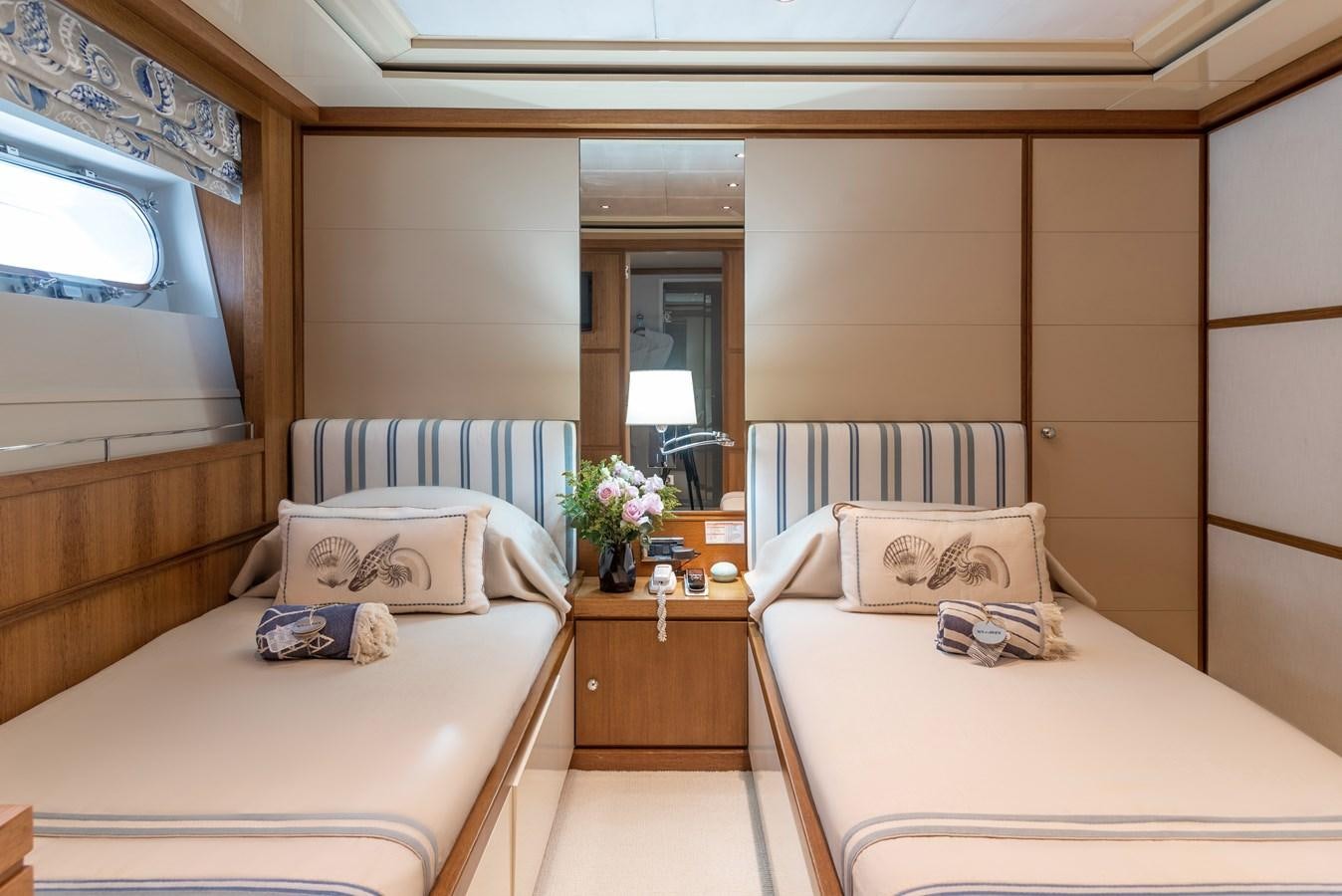 a room with two beds aboard IRAVATI Yacht for Sale