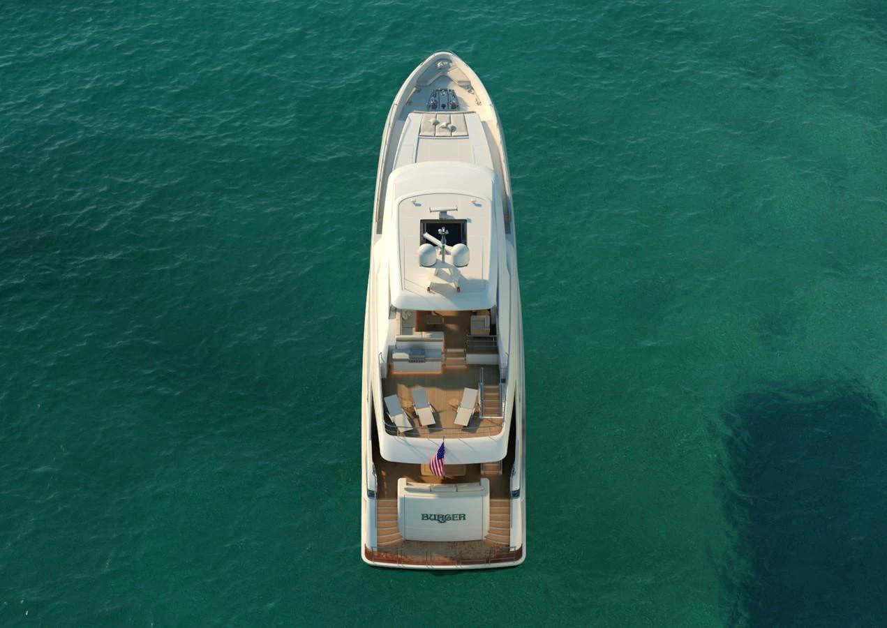 a small wooden boat aboard BURGER 120 Yacht for Sale