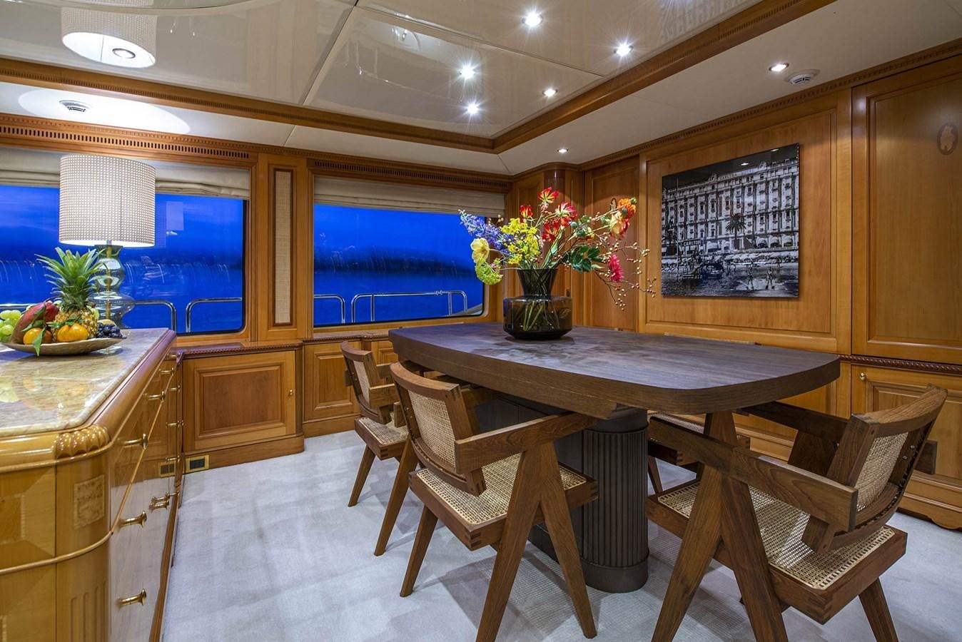 a room with a table and chairs aboard NEW STAR Yacht for Sale