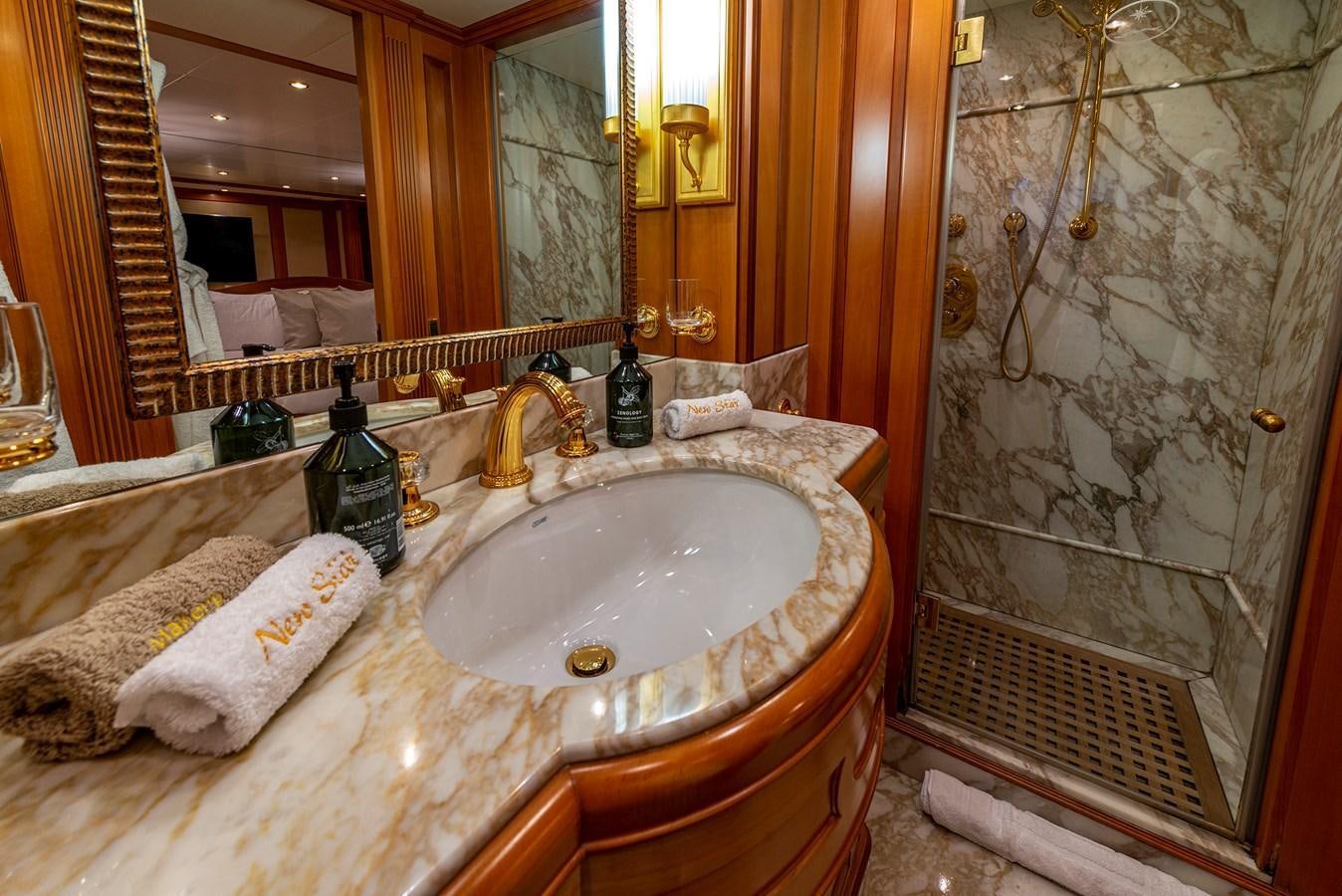 a bathroom with a sink and a shower aboard NEW STAR Yacht for Sale