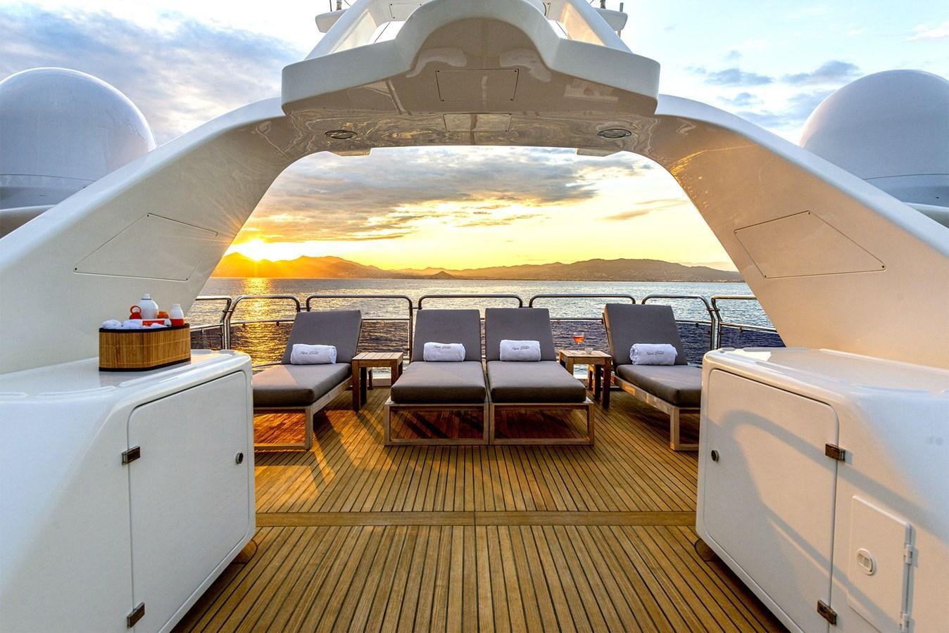a room with a large white and yellow ceiling and a large white object with chairs and a large aboard NEW STAR Yacht for Sale