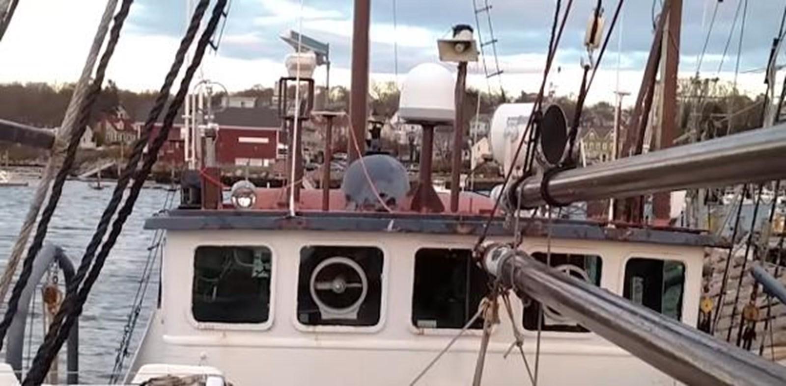 a white boat with red sails aboard 1963 TRAWLER DE HASS NORTH SEA, WANDERBIRD  Yacht for Sale
