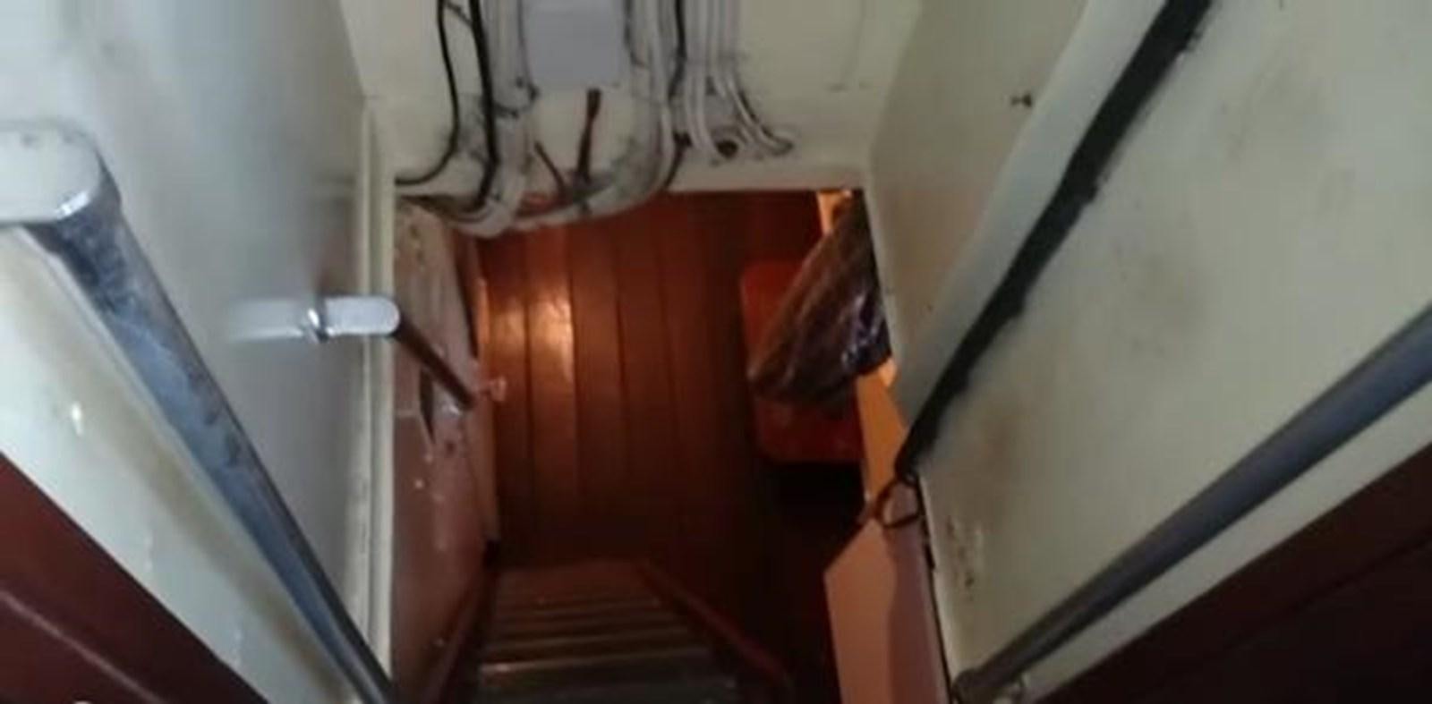a staircase with a metal railing aboard 1963 TRAWLER DE HASS NORTH SEA, WANDERBIRD  Yacht for Sale
