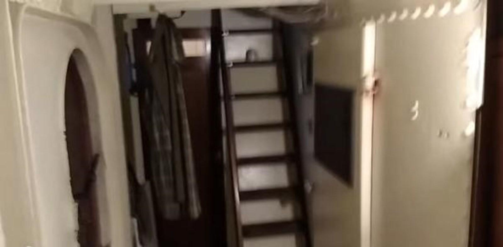 a closet with clothes on the wall aboard 1963 TRAWLER DE HASS NORTH SEA, WANDERBIRD  Yacht for Sale