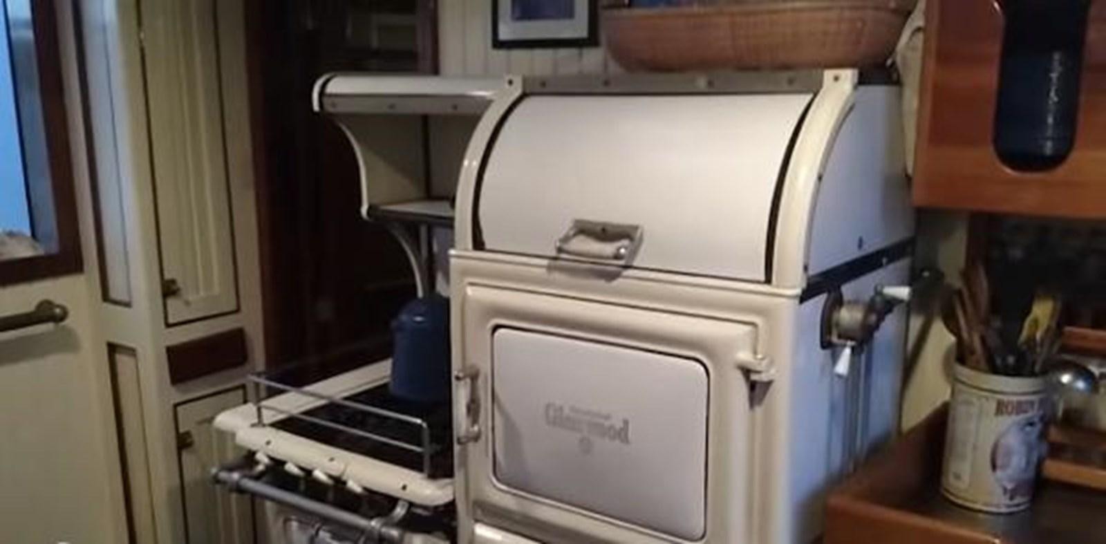 a white machine in a kitchen aboard 1963 TRAWLER DE HASS NORTH SEA, WANDERBIRD  Yacht for Sale