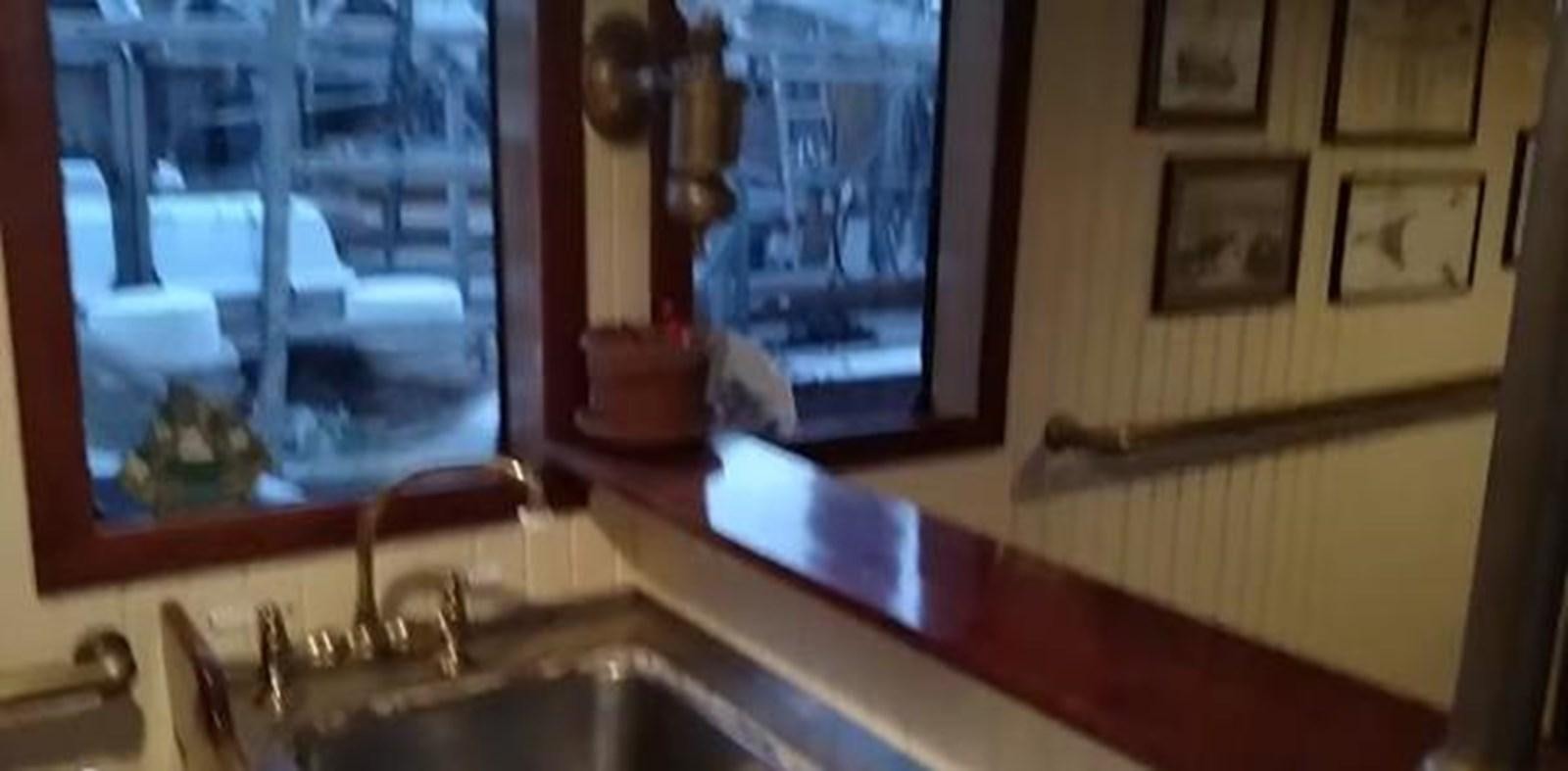 a kitchen sink with a mirror aboard 1963 TRAWLER DE HASS NORTH SEA, WANDERBIRD  Yacht for Sale