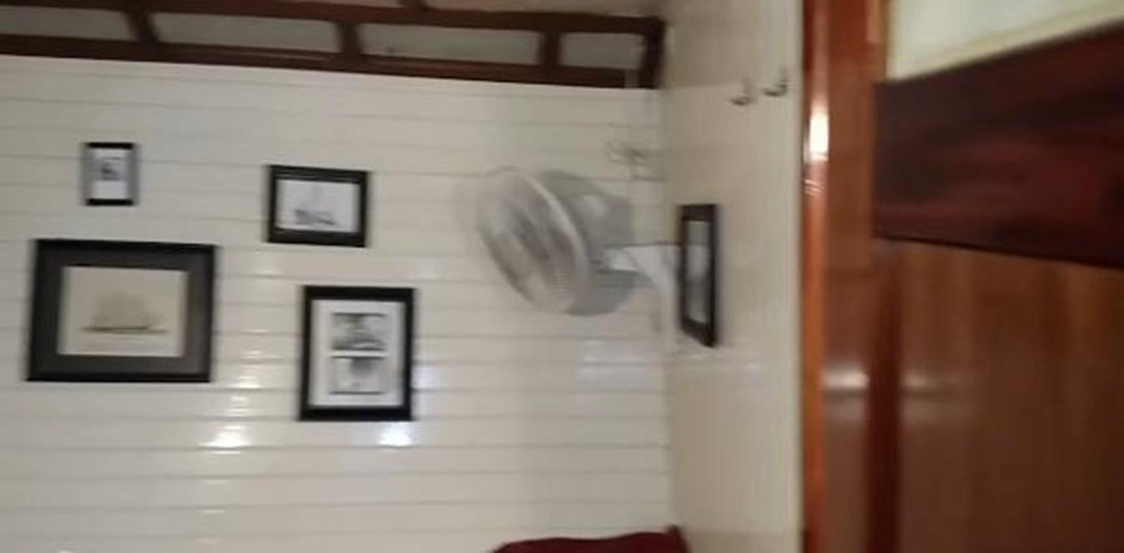 a room with pictures on the wall aboard 1963 TRAWLER DE HASS NORTH SEA, WANDERBIRD  Yacht for Sale