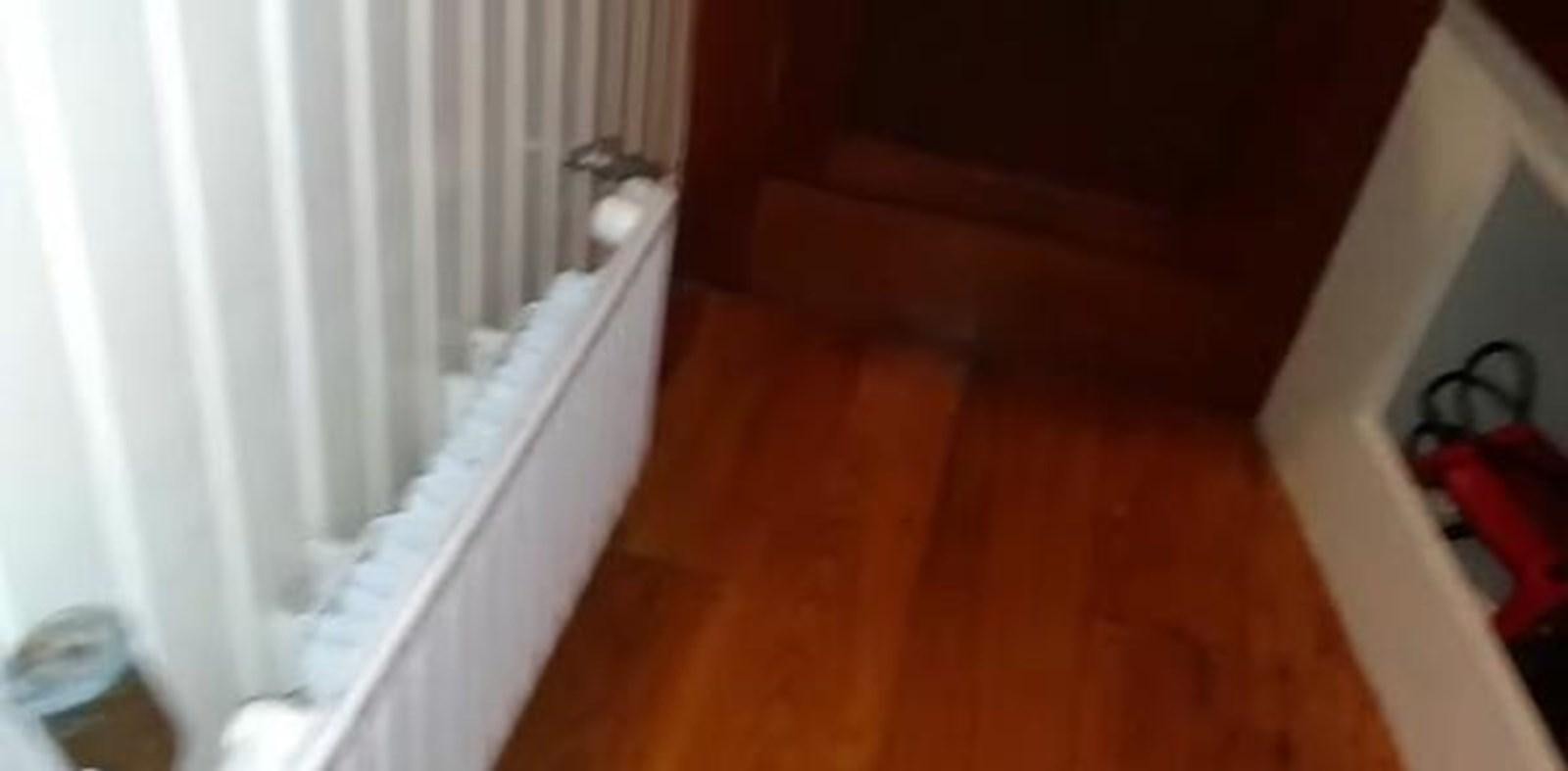 a room with a wood floor and white curtains aboard 1963 TRAWLER DE HASS NORTH SEA, WANDERBIRD  Yacht for Sale