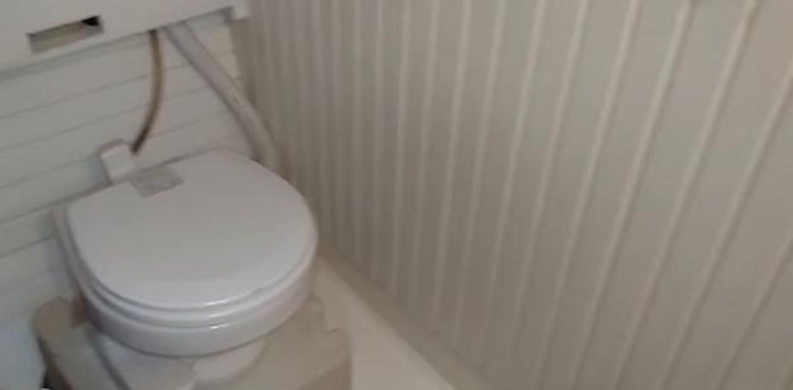 a toilet with a wooden handle aboard 1963 TRAWLER DE HASS NORTH SEA, WANDERBIRD  Yacht for Sale