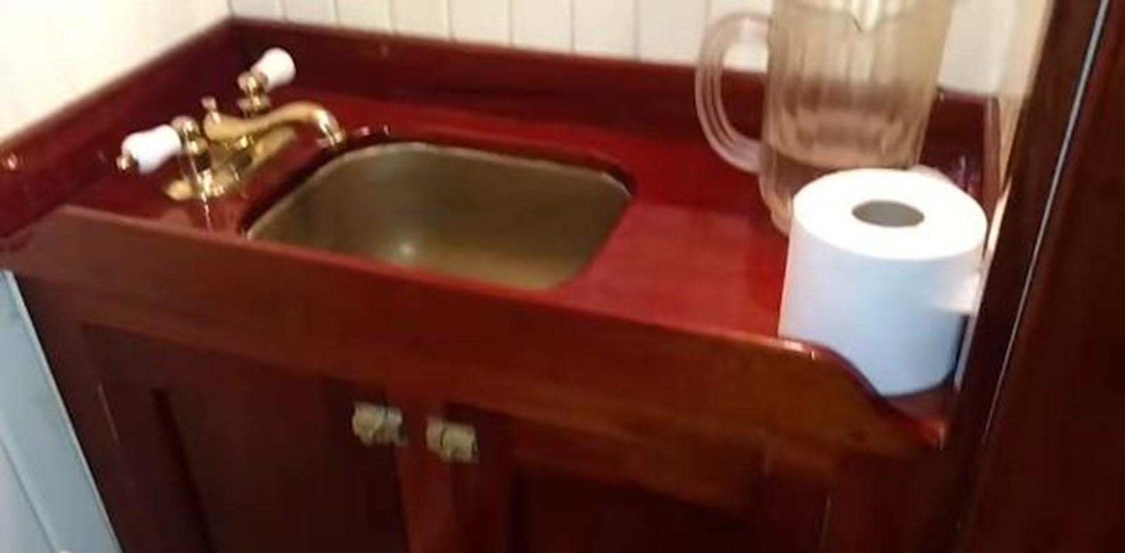a sink with a faucet and a soap dispenser aboard 1963 TRAWLER DE HASS NORTH SEA, WANDERBIRD  Yacht for Sale