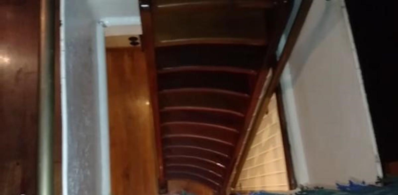 a red staircase with white walls aboard 1963 TRAWLER DE HASS NORTH SEA, WANDERBIRD  Yacht for Sale