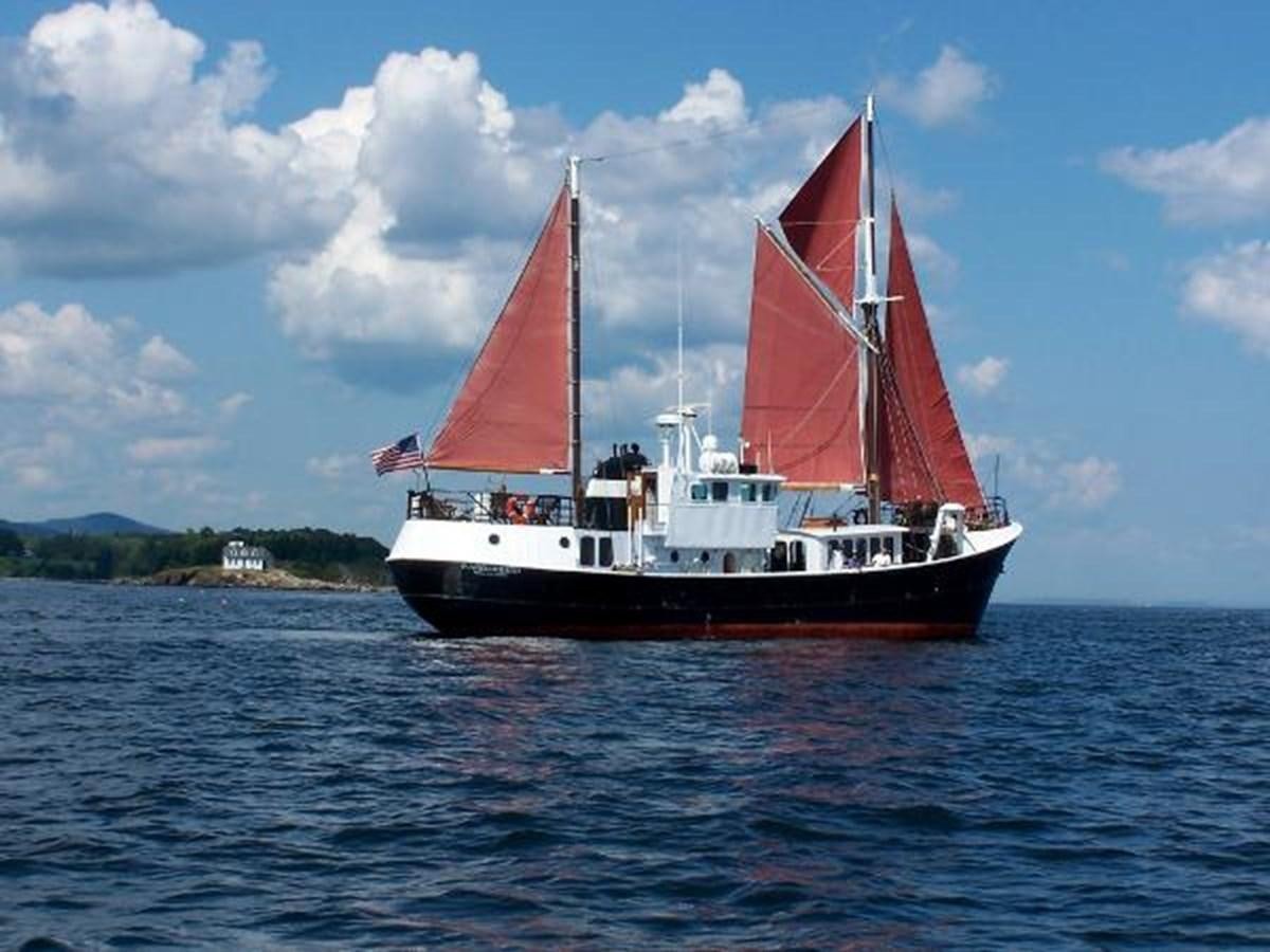 a red and white boat on the water aboard 1963 TRAWLER DE HASS NORTH SEA, WANDERBIRD  Yacht for Sale