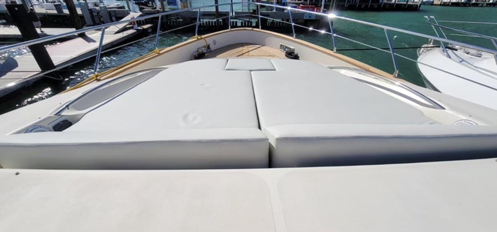 a white boat in a large body of water aboard THINKS 'S HIS TOO Yacht for Sale