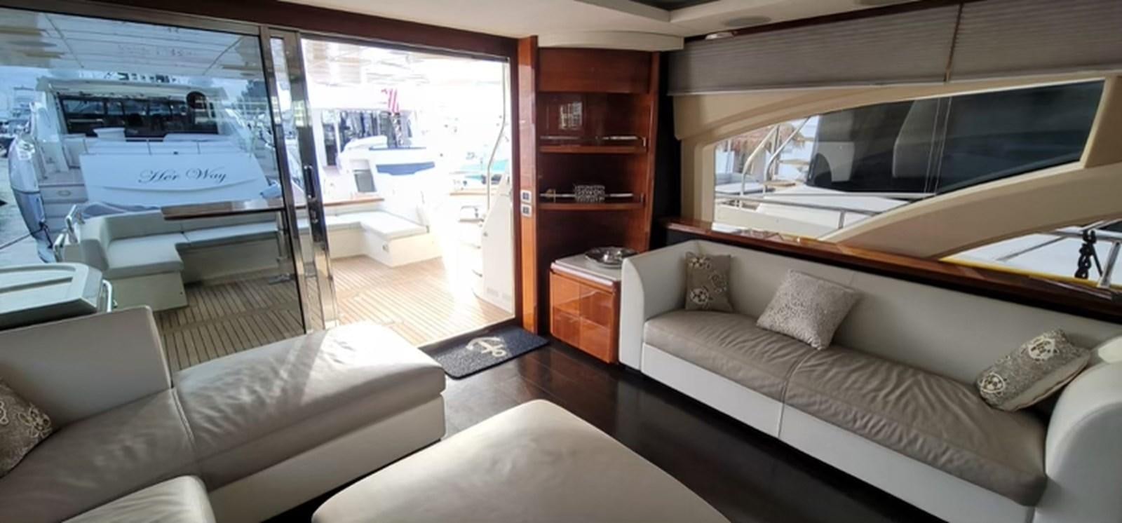 a living room with a large window aboard THINKS 'S HIS TOO Yacht for Sale