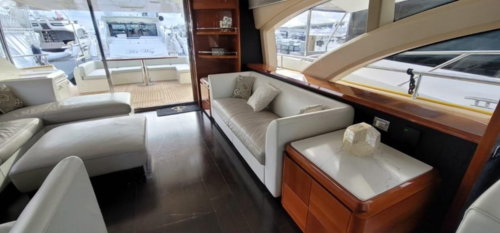 a room with a couch and a table aboard THINKS 'S HIS TOO Yacht for Sale
