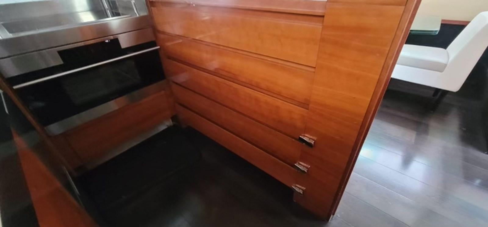 a wooden cabinet with drawers aboard THINKS 'S HIS TOO Yacht for Sale