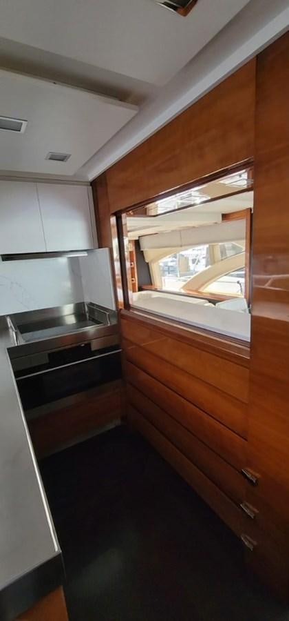 a kitchen with a sink and cabinets aboard THINKS 'S HIS TOO Yacht for Sale