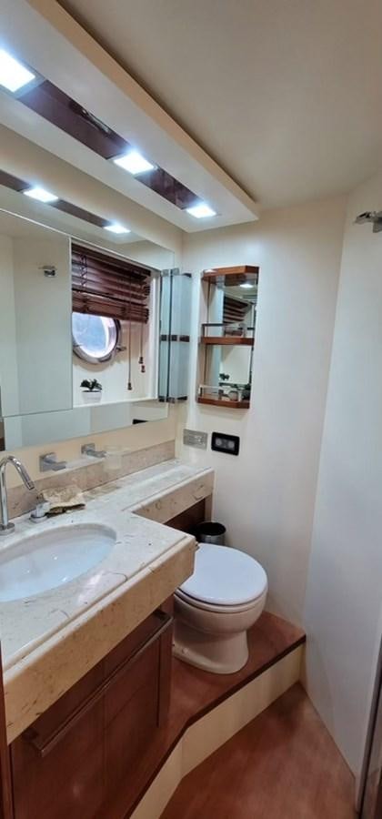 a bathroom with a toilet and sink aboard THINKS 'S HIS TOO Yacht for Sale