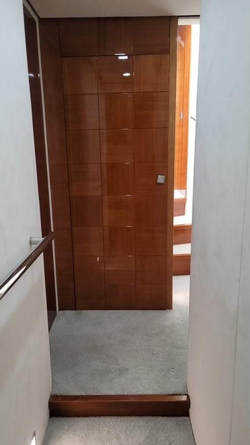 a wooden door with a metal handle aboard THINKS 'S HIS TOO Yacht for Sale