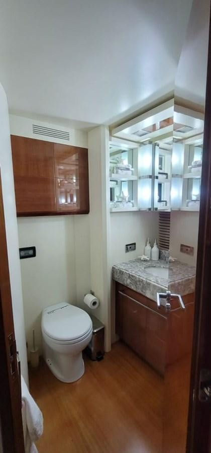 a bathroom with a toilet and a sink aboard THINKS 'S HIS TOO Yacht for Sale