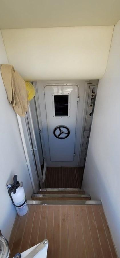 a small white cabinet in a room aboard THINKS 'S HIS TOO Yacht for Sale