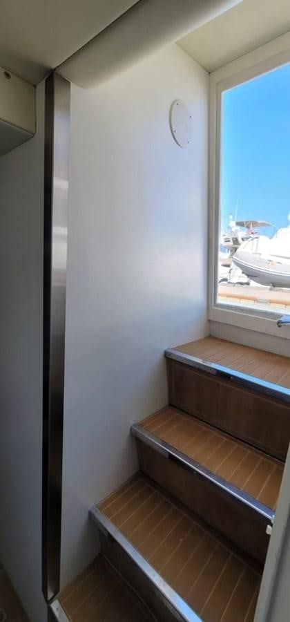 a window with a wooden frame aboard THINKS 'S HIS TOO Yacht for Sale