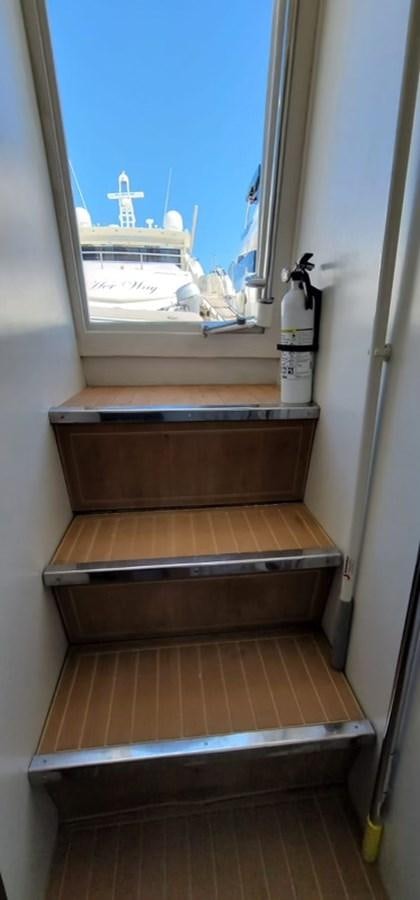 a wooden door with a window aboard THINKS 'S HIS TOO Yacht for Sale