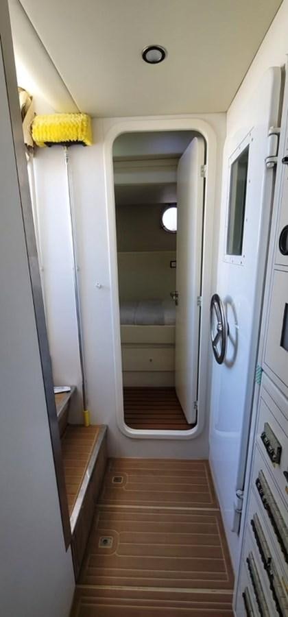 a white door with a yellow flower on it aboard THINKS 'S HIS TOO Yacht for Sale