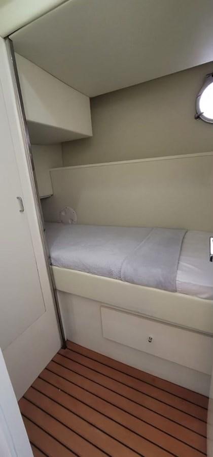a bed in a room aboard THINKS 'S HIS TOO Yacht for Sale