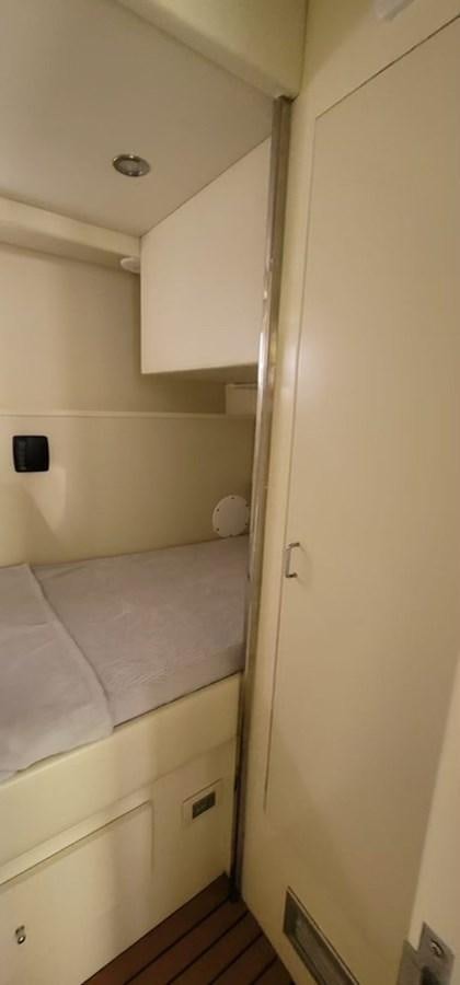a small room with a bed aboard THINKS 'S HIS TOO Yacht for Sale