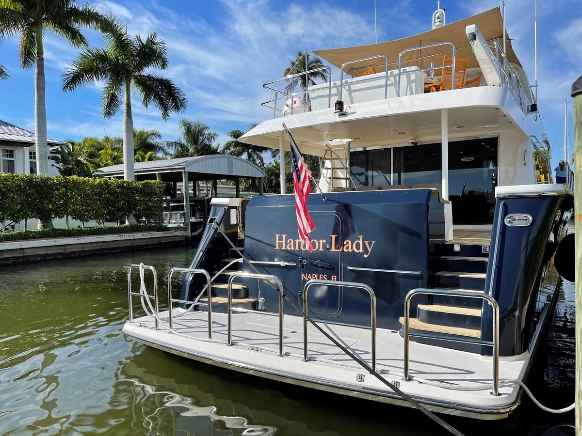 a boat docked at a pier aboard HARBOR LADY Yacht for Sale