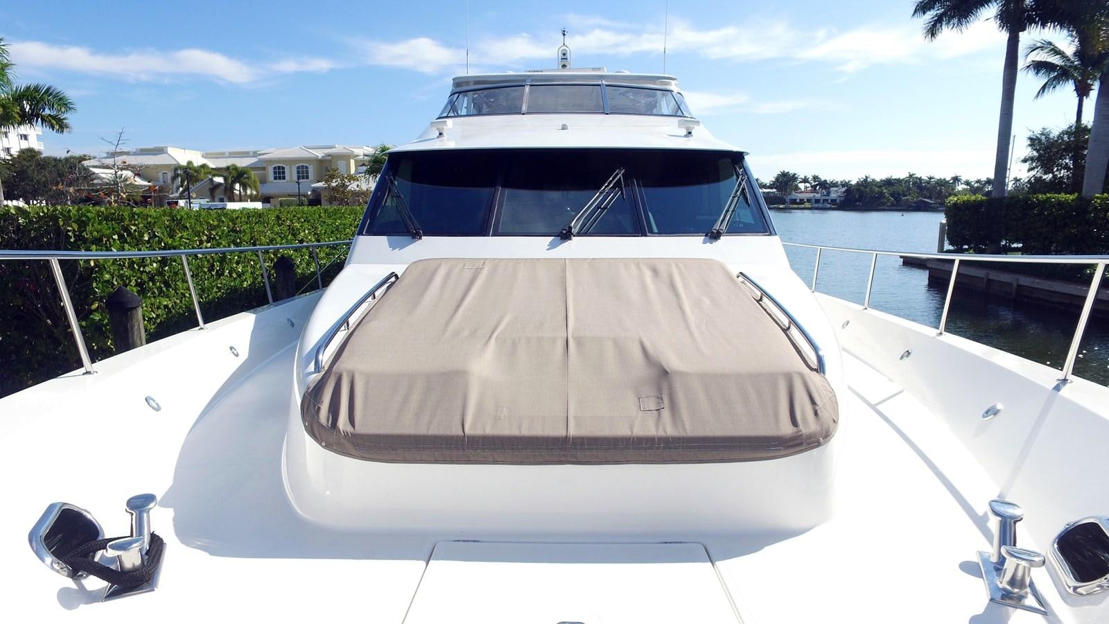 a white yacht on a dock aboard HARBOR LADY Yacht for Sale