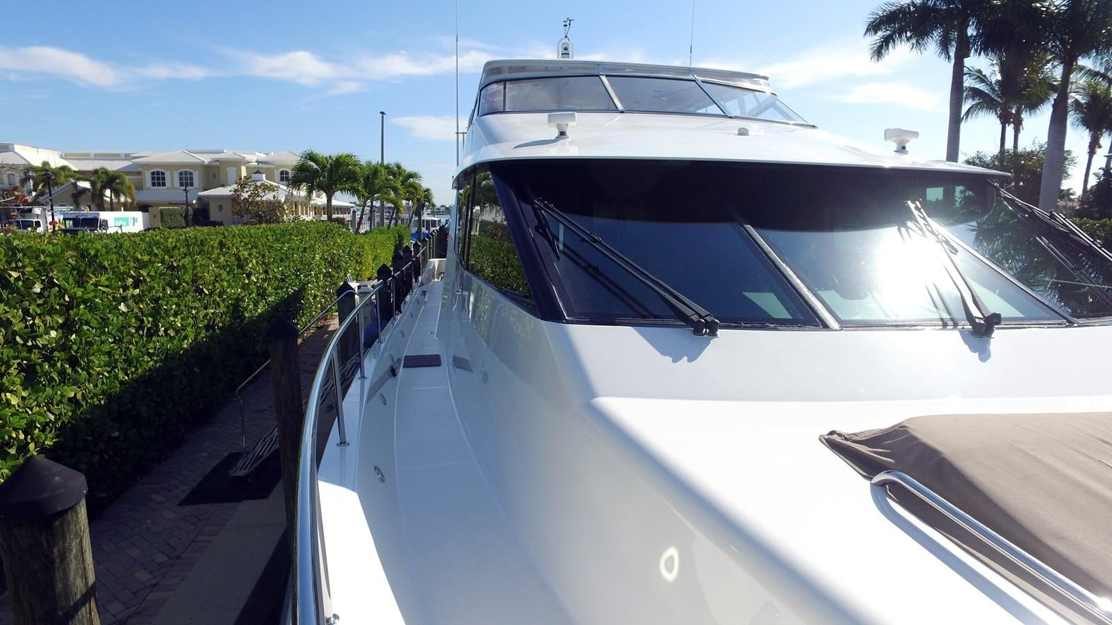 a white yacht parked on a dock aboard HARBOR LADY Yacht for Sale