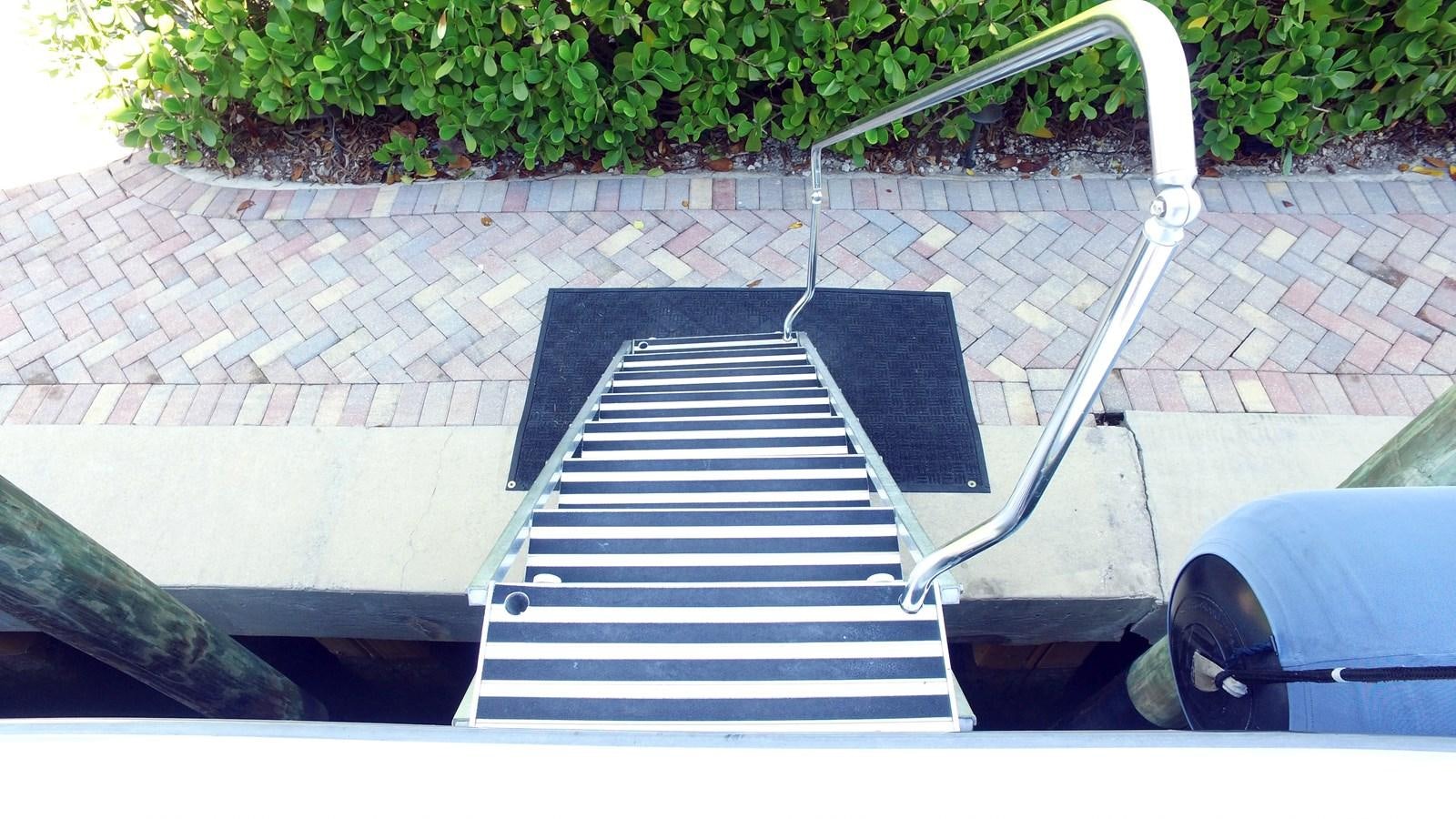 a white and black staircase aboard HARBOR LADY Yacht for Sale