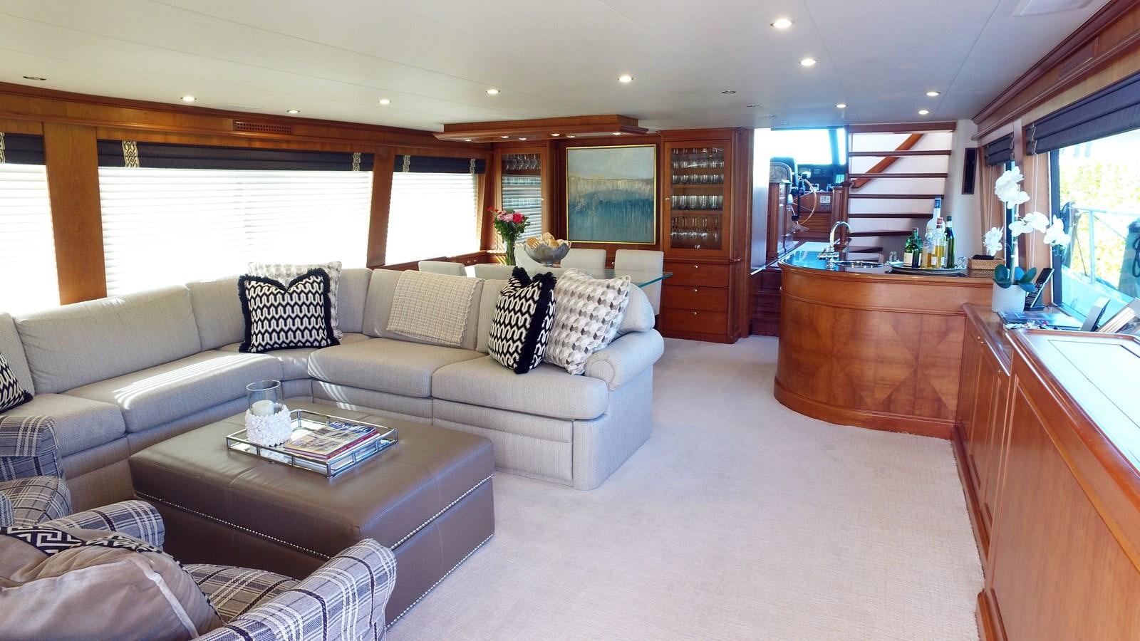 a living room with a couch and coffee table aboard HARBOR LADY Yacht for Sale