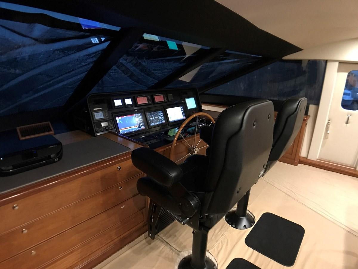 a black office chair in front of a computer desk aboard HARBOR LADY Yacht for Sale