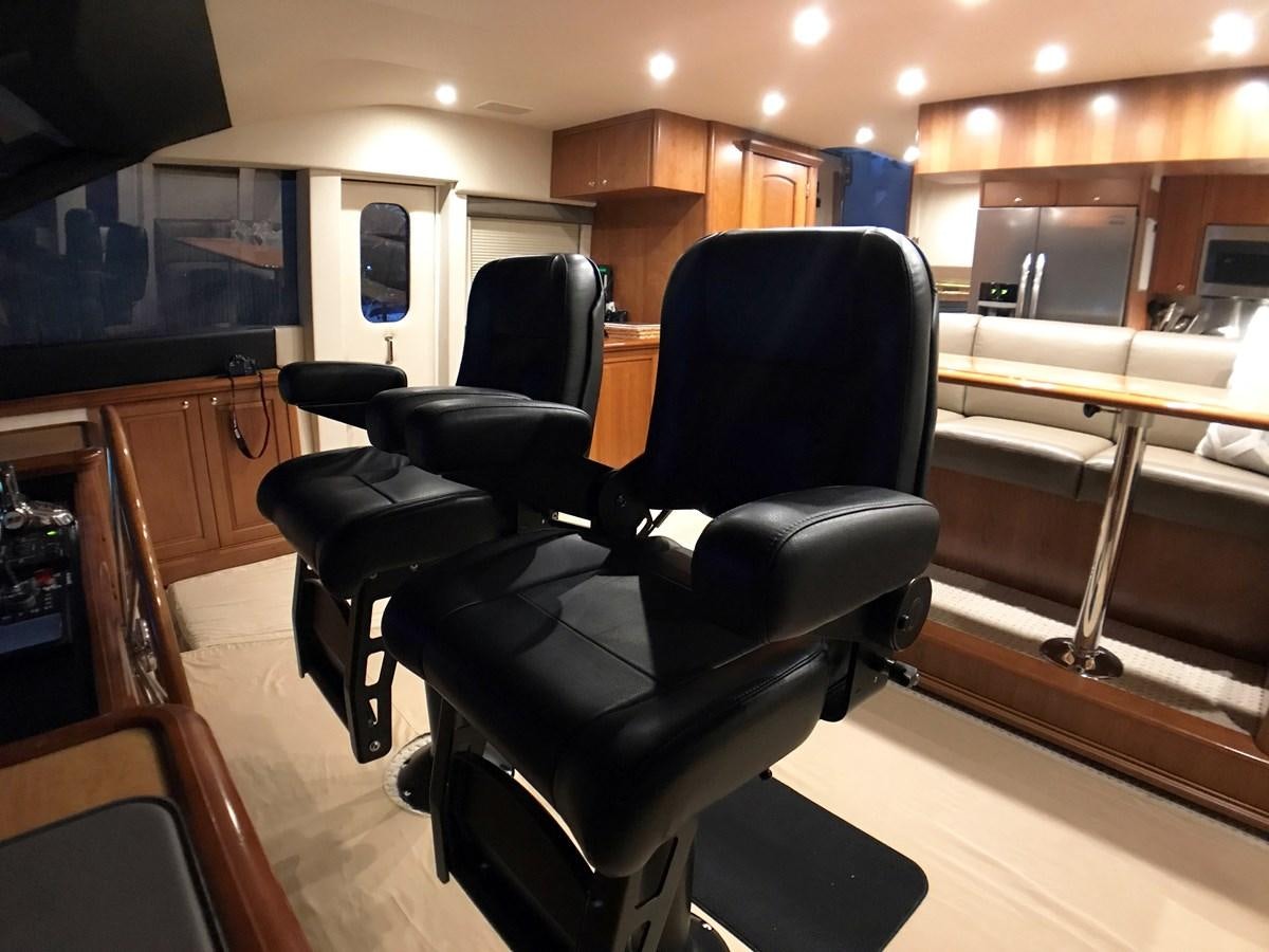 a room with chairs and a table aboard HARBOR LADY Yacht for Sale