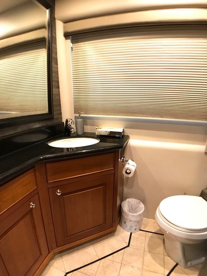 a bathroom with a sink toilet and a bathtub aboard HARBOR LADY Yacht for Sale
