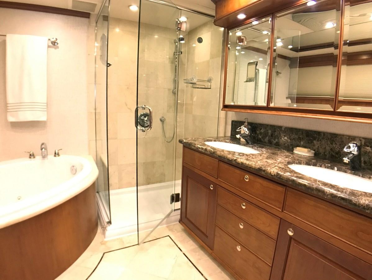 a bathroom with a standup shower aboard HARBOR LADY Yacht for Sale