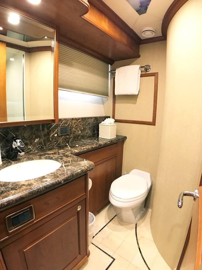 a bathroom with a sink and toilet aboard HARBOR LADY Yacht for Sale