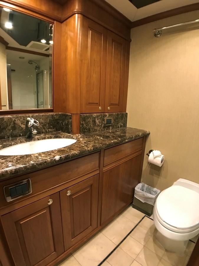 a bathroom with a sink and a toilet aboard HARBOR LADY Yacht for Sale
