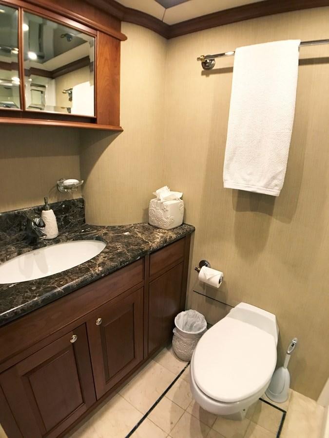 a bathroom with a toilet and a sink aboard HARBOR LADY Yacht for Sale