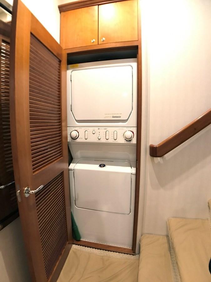 a small kitchen with a microwave aboard HARBOR LADY Yacht for Sale