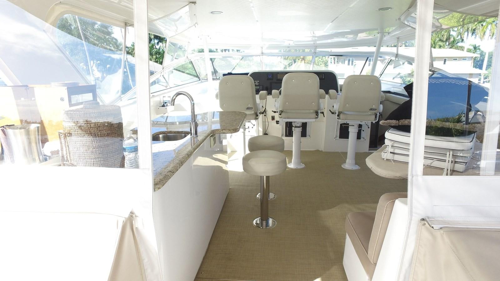 a room with chairs and tables aboard HARBOR LADY Yacht for Sale