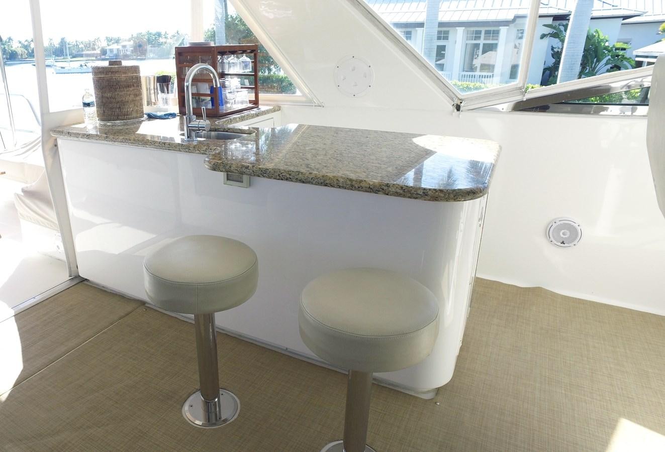 a bathroom with a sink and stool aboard HARBOR LADY Yacht for Sale