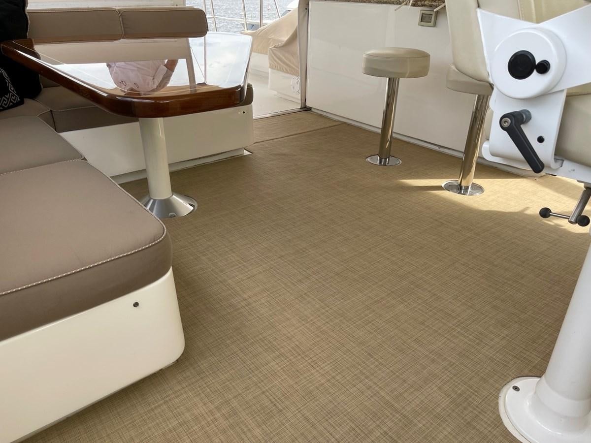 a room with a couch and a chair aboard HARBOR LADY Yacht for Sale